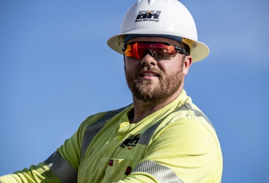 Headshot of lineman against a background of blue sky