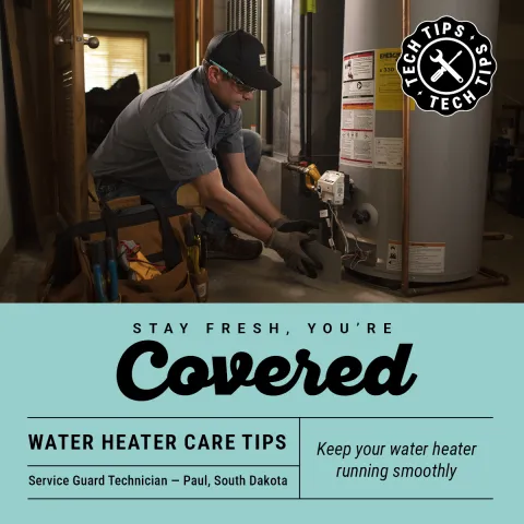 Service Guard tech repairing water heater